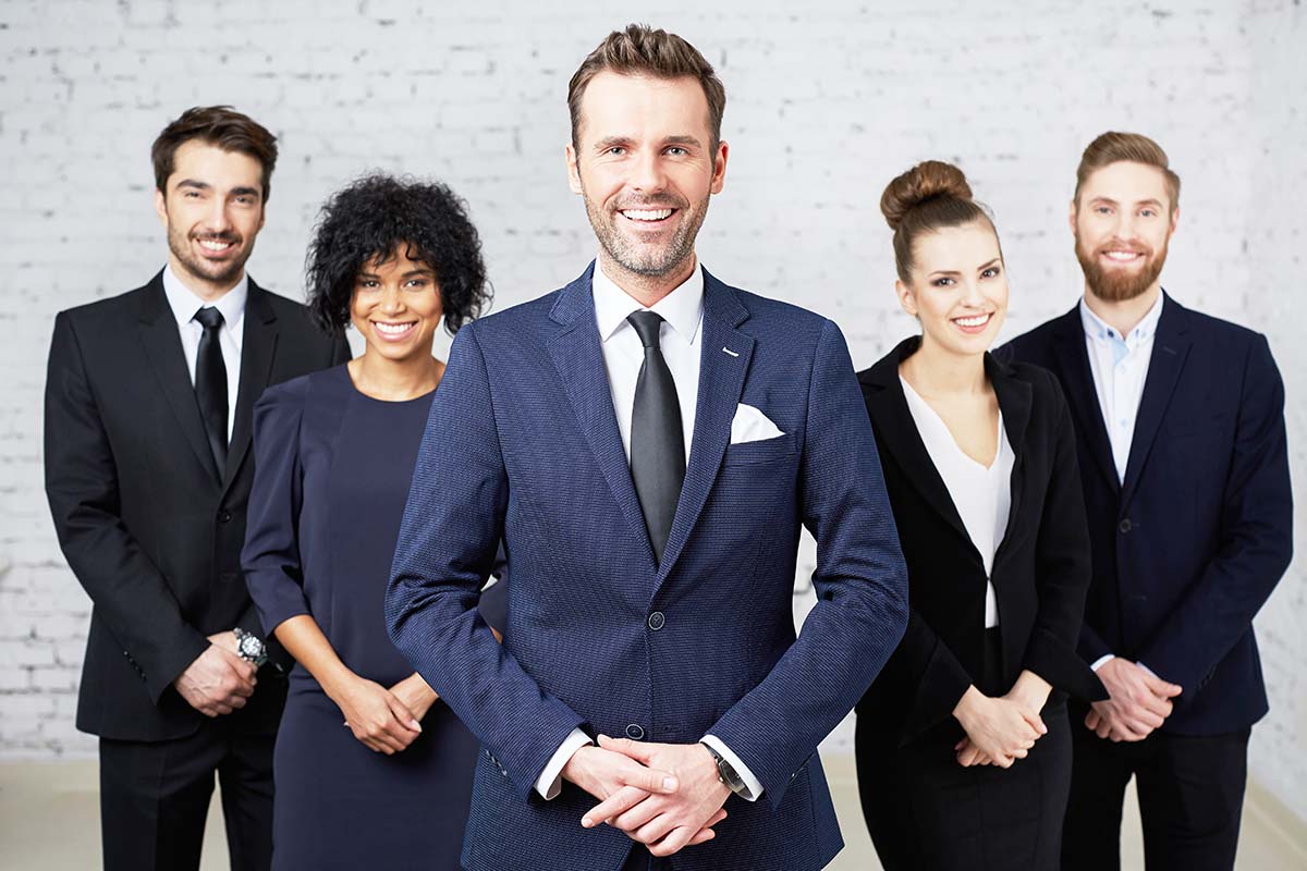 A group of lawyers and attorneys standing together in tempe arizona law firm