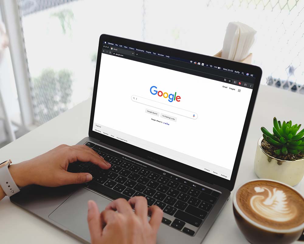 google search engine page open on laptop on table