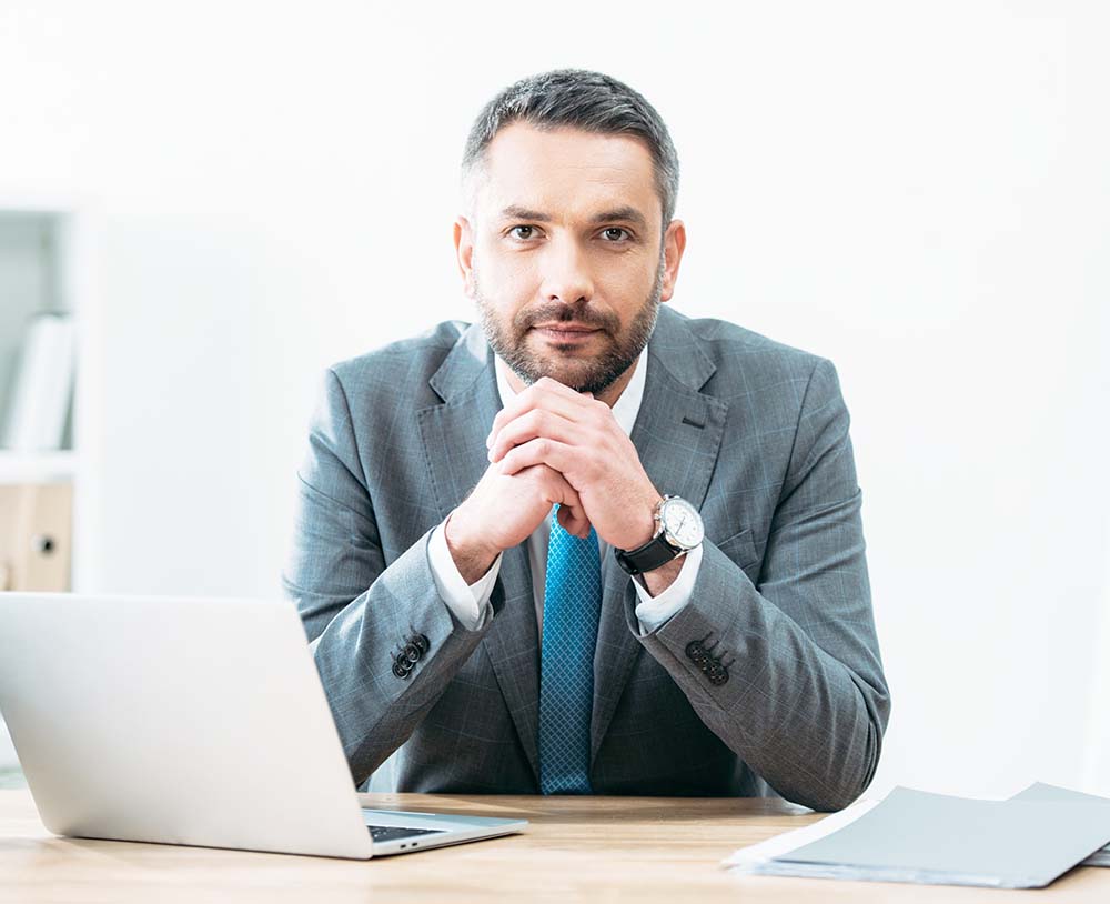 male attorney from phoenix arizona sitting at desk