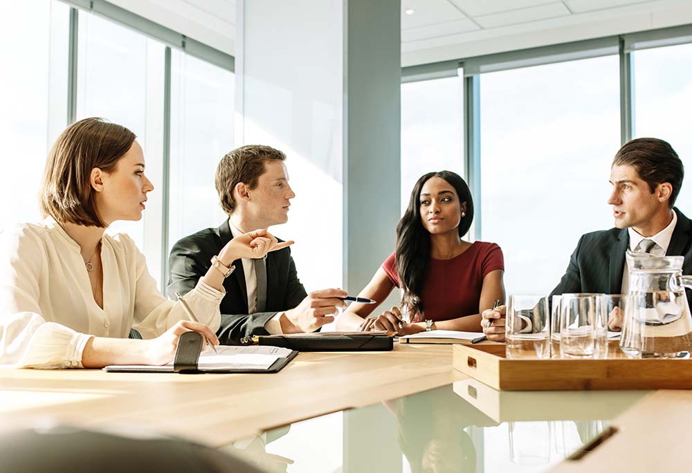 attorneys sitting at san bernardino law firm table
