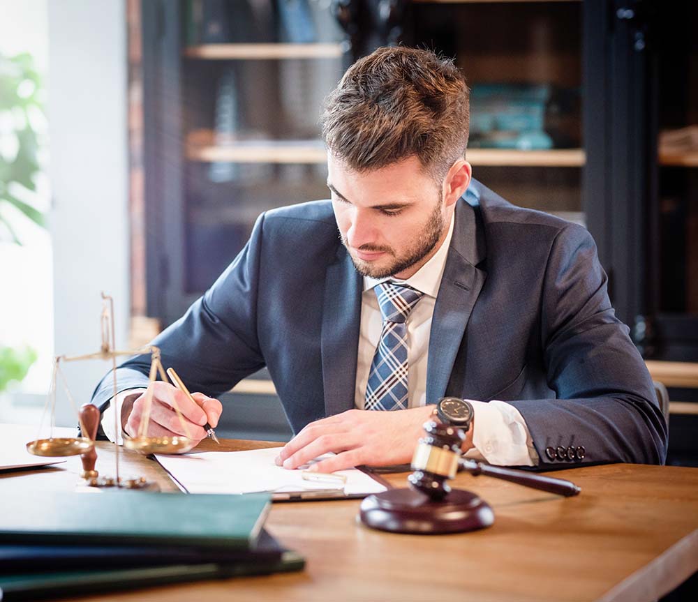 male attorney sitting at desk in chula vista, california law firm