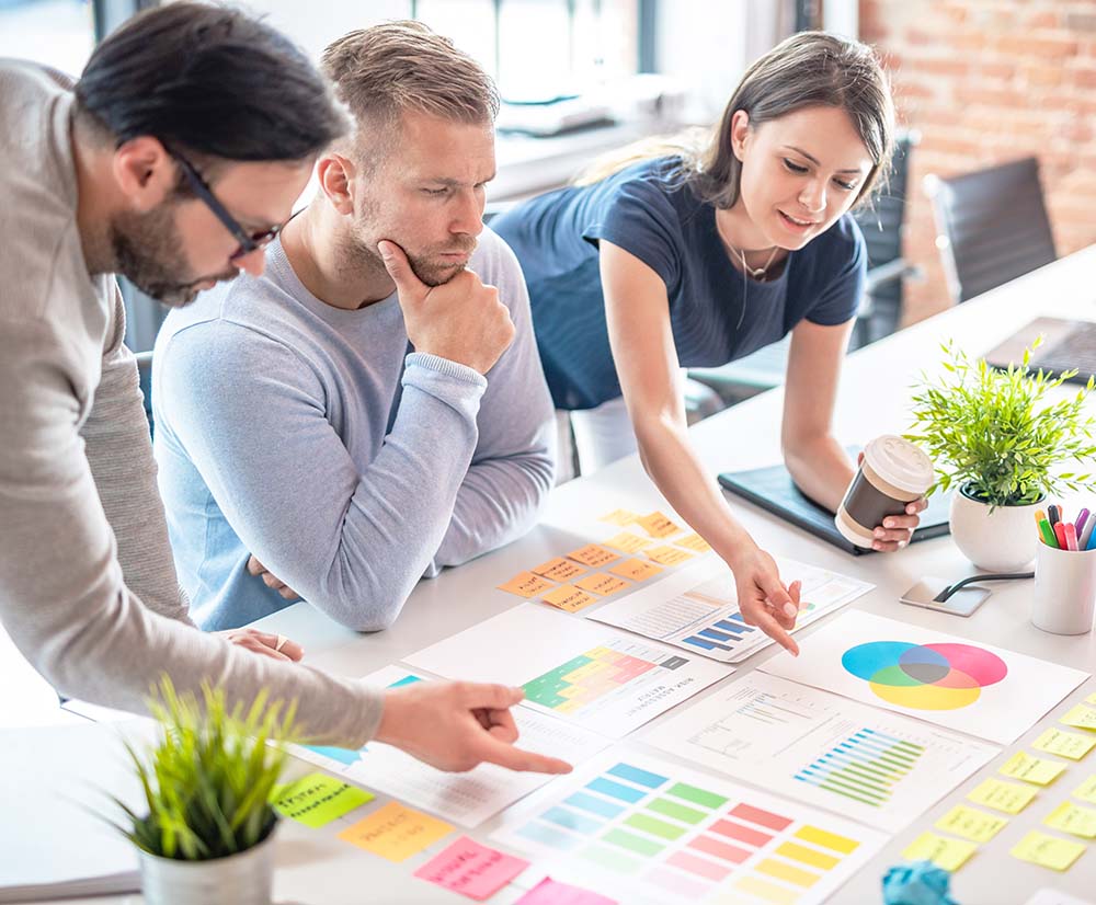 A group of seo experts for attorneys standing around table