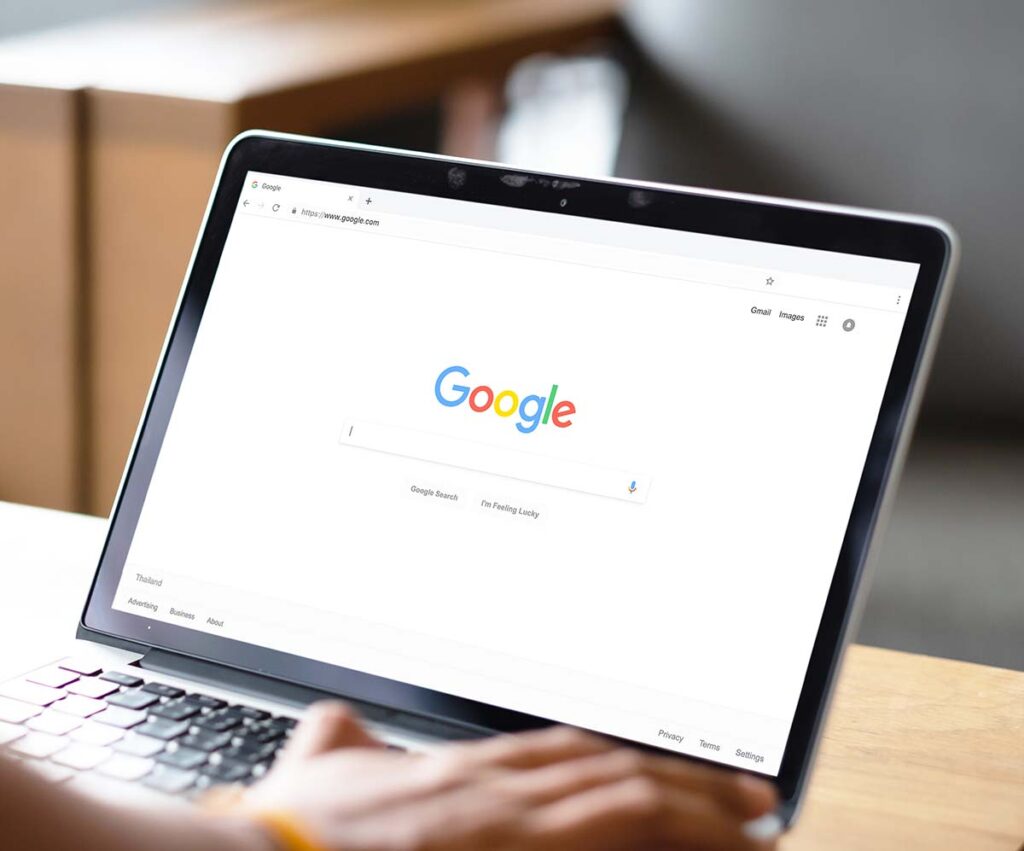 google search engine webpage open on laptop on desk