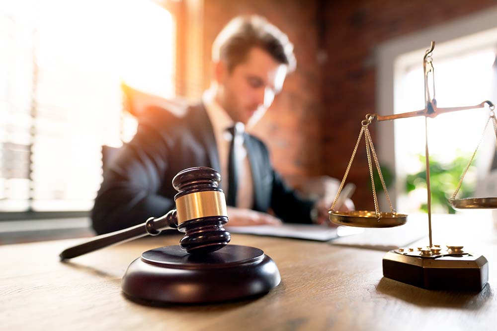 Attorney working in law firm office.
