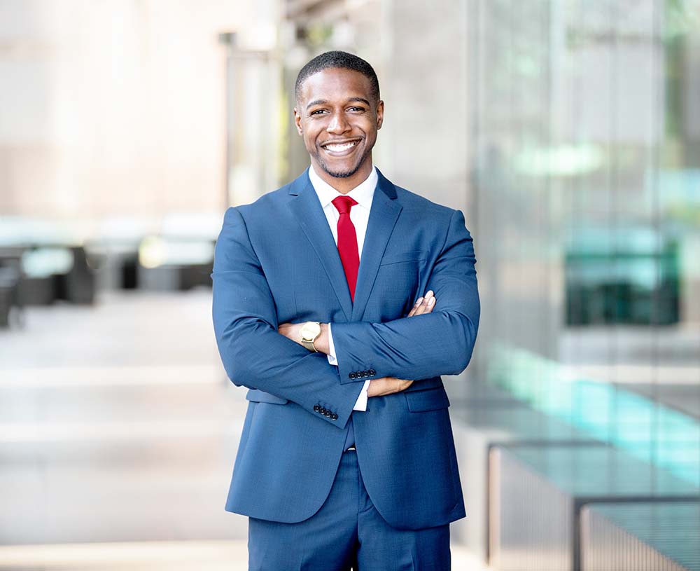 african american attorney standing in front of Yuma arizona law firm building