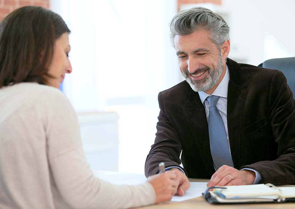 attorney in sacramento california meeting with a client in law firm office