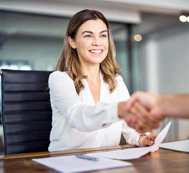 female attorney shaking the hand of her client