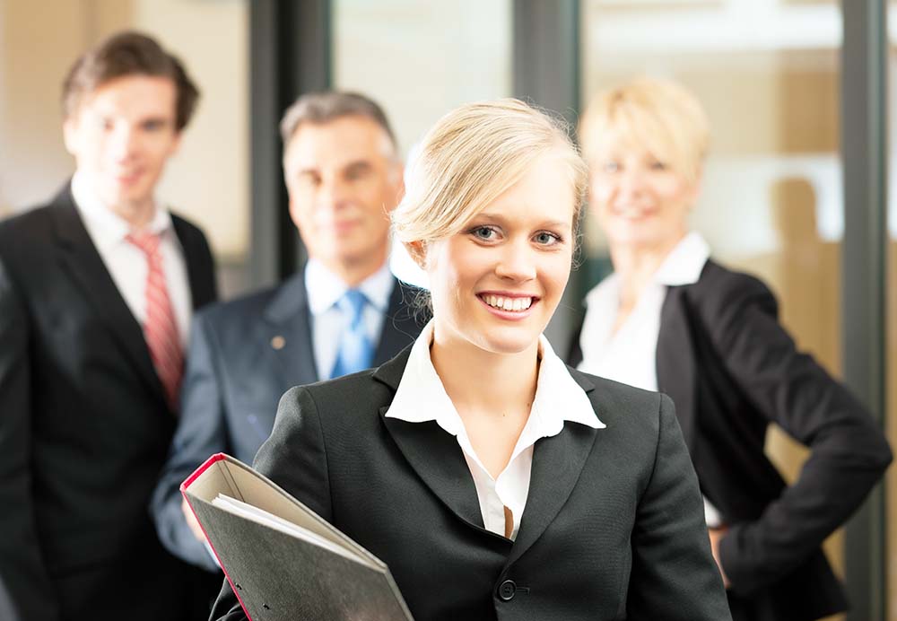 female and male attorneys standing inside Fremont, CA law firm office