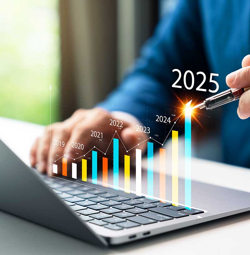 a laptop with a bar chart showing increasing momentum