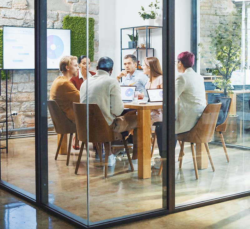 group of seo experts and professional for law firms sitting around a table discussing marketing matters