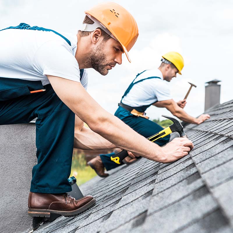 roofer on the roof of a residential home