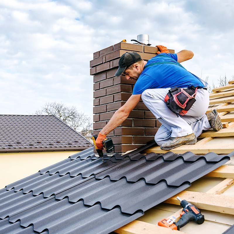 a professional roofer installing a roof on a home